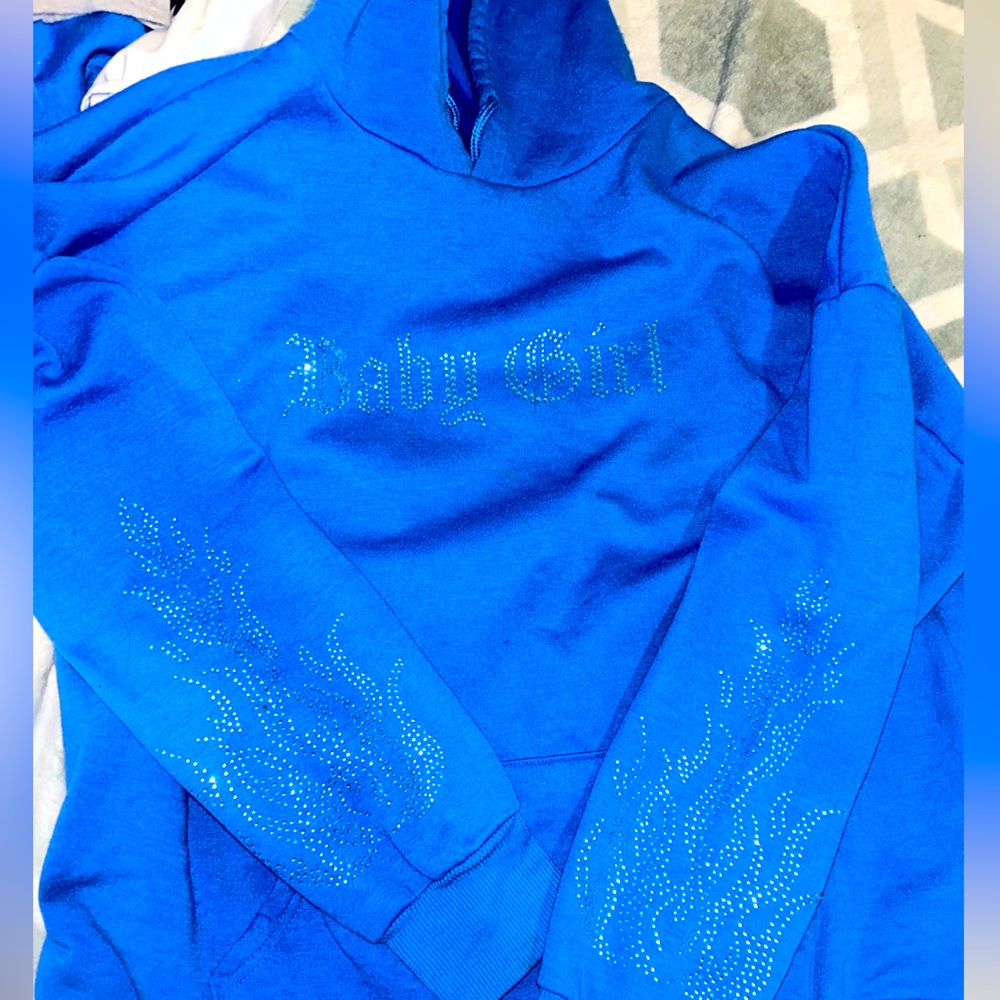 Blue sweater with diamonds from faded rose two sizes.